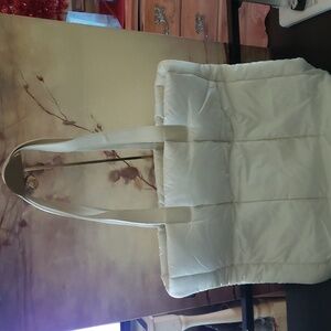 Furla Puffer bag with what seems to be leather straps and bottom